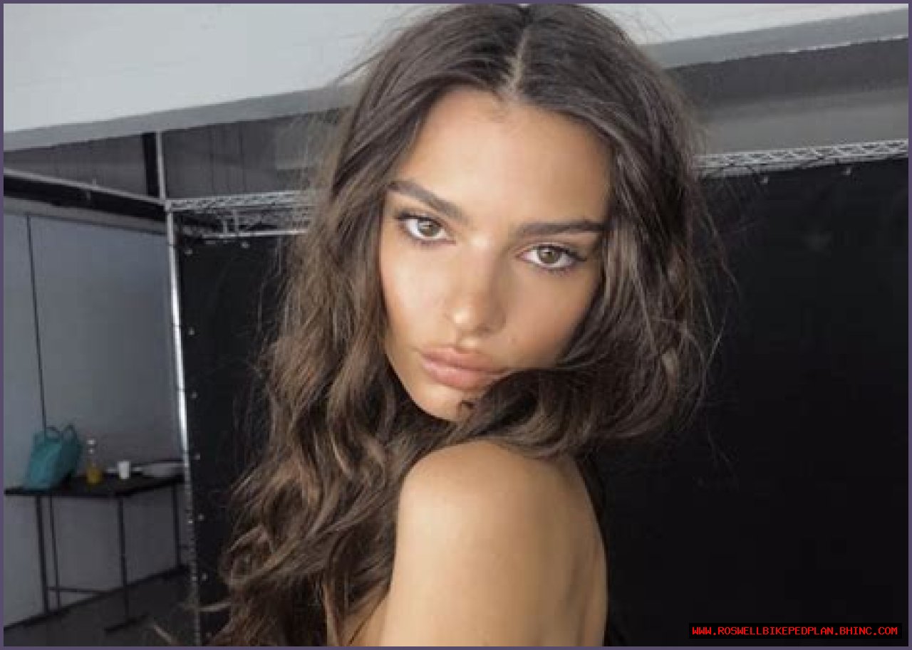 Emily Ratajkowski Puts On Cheeky Display In Barely-There Bathing Suit